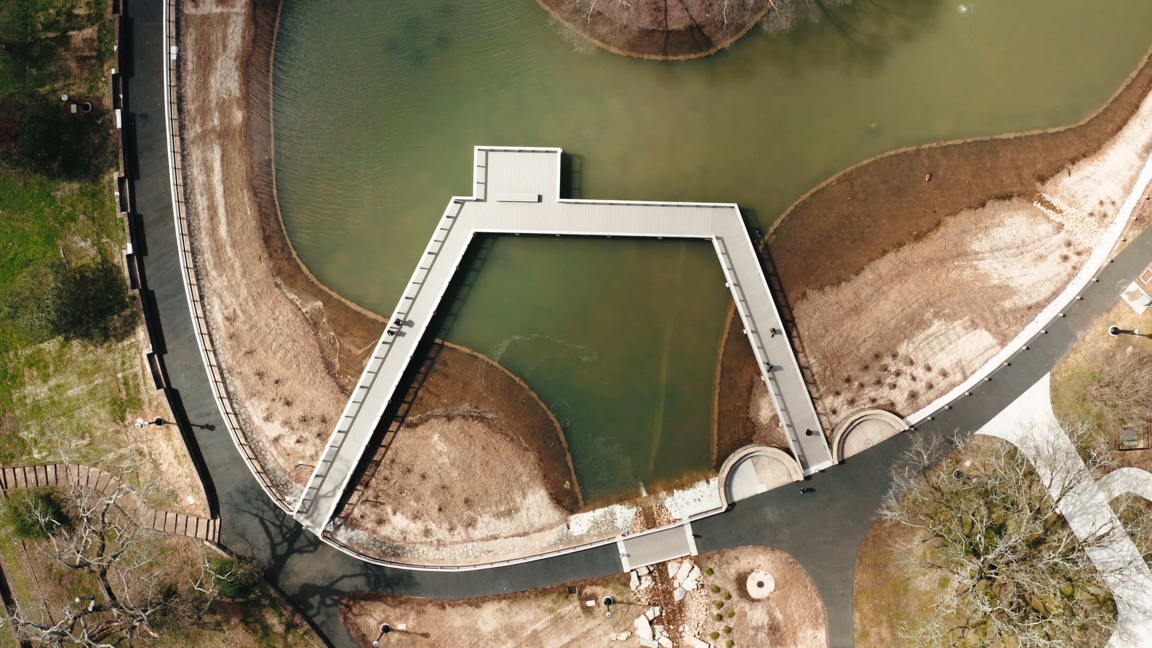 Aerial View Of A Park With A Man Made Lake Free Stock Video