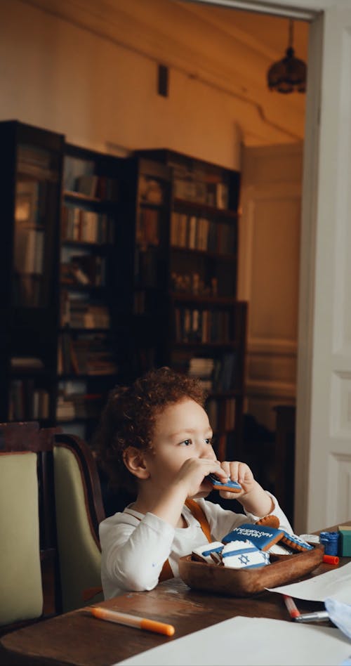 A Young Boy Funnily Refusing To Share Hanukkah Cookies