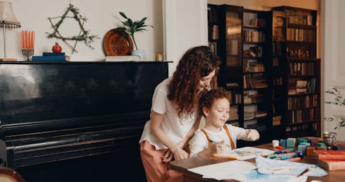 A Mother Encouraging Her Son On His Artwork