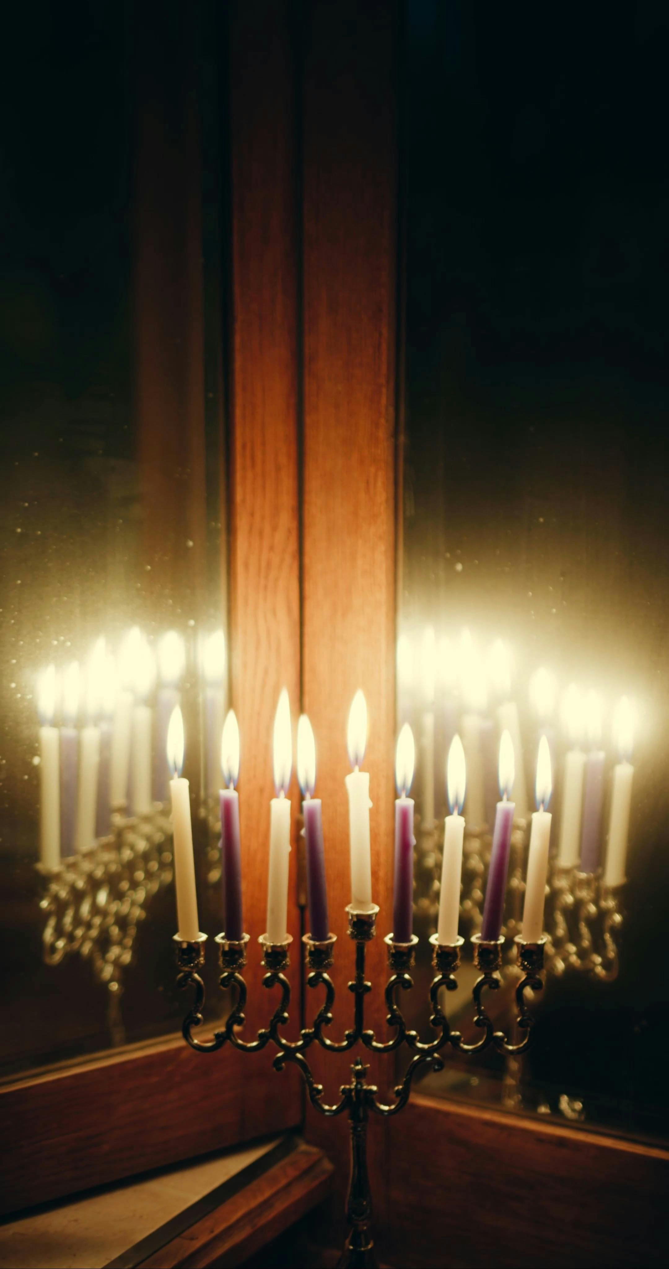 A Woman And Lighted Candles Reflection In A Mirror · Free Stock Video