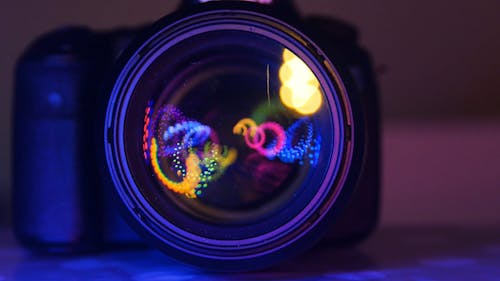 Dancing Lights Of Different Color Inside The Lens Of A Camera