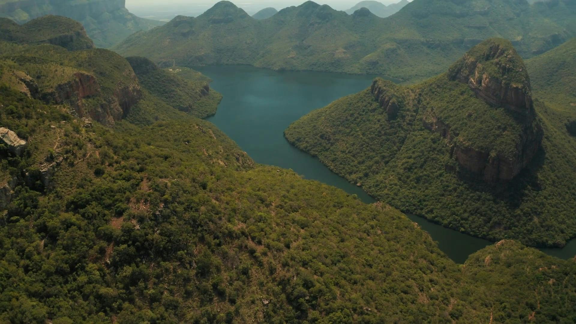 Drone Footage Of A Lake Valley In Between Mountains · Free Stock Video