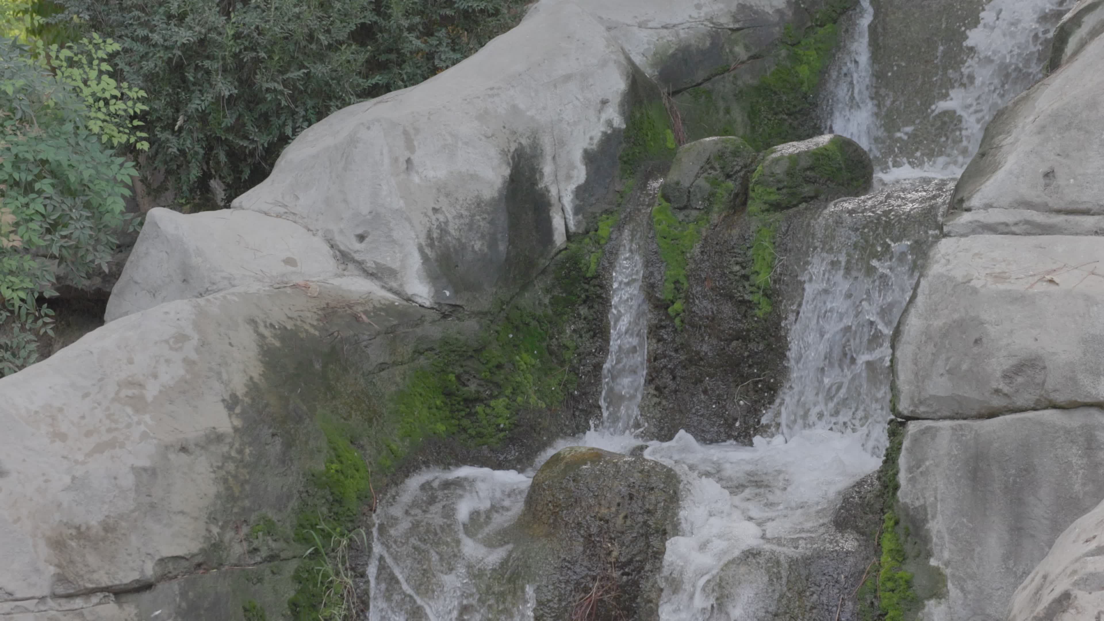 Tranquil Waterfall Flowing Over Mossy Rocks Free Stock Video Footage ...