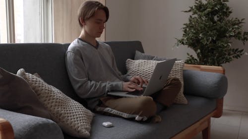 Young Man Using A Laptop