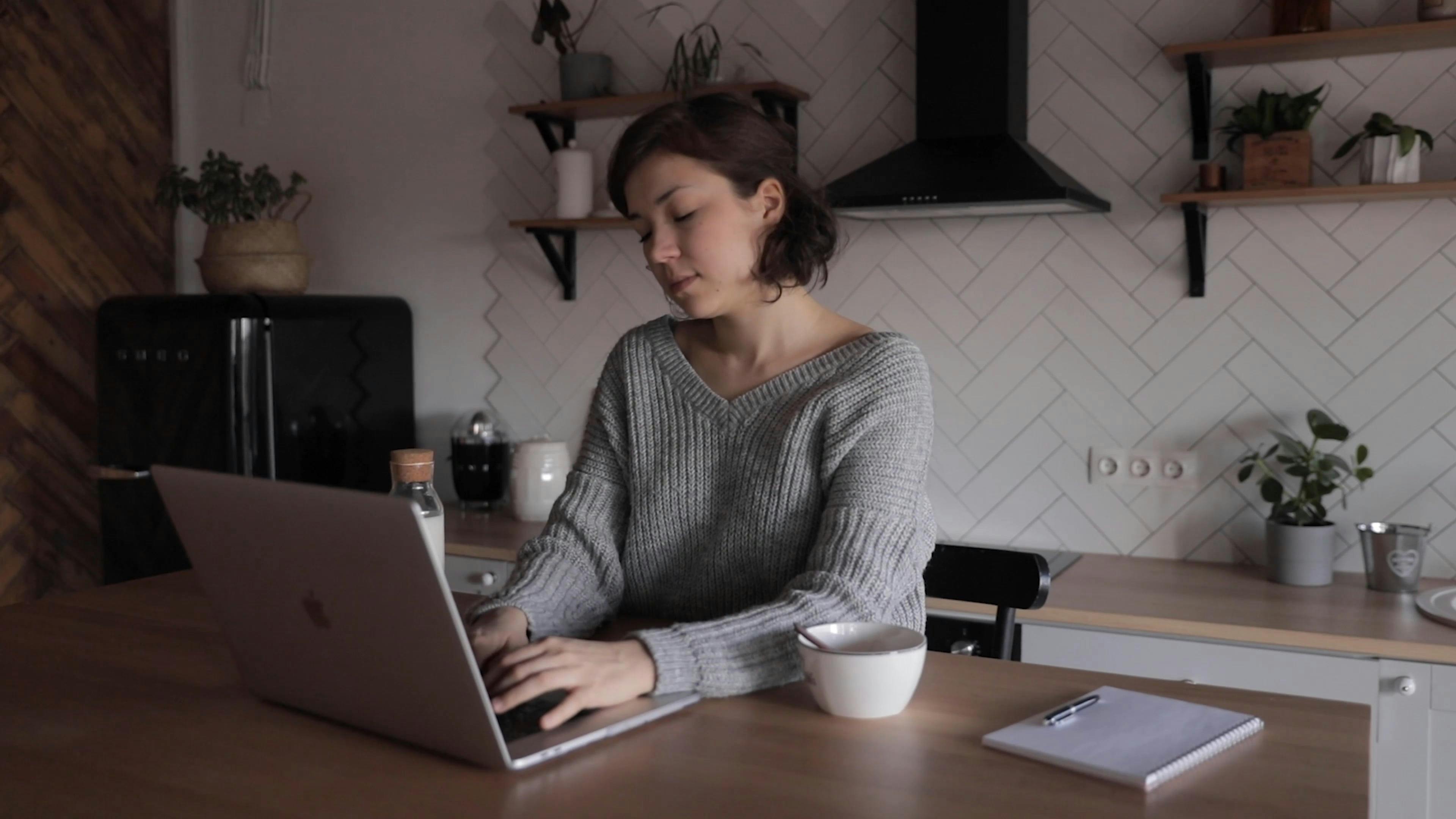 Woman Using Laptop While Drinking Milk · Free Stock Video