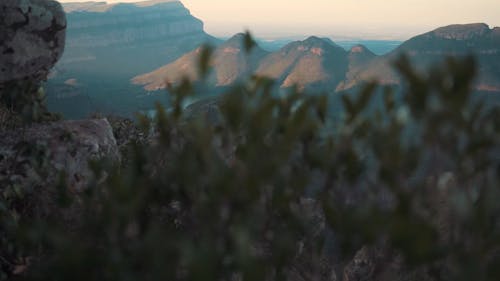 A Woman Standing on the Edge of a Cliff