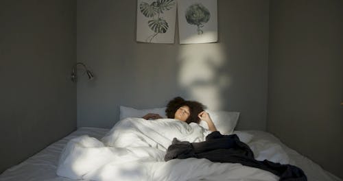 A Woman Wakes Up On A Beautiful Morning Sunlight