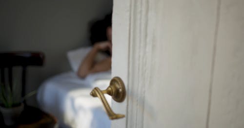 A Door Opens To See  Woman Woke Up From Sleep