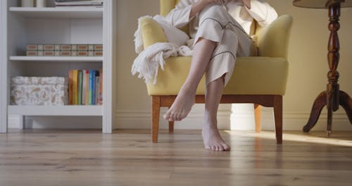 A Woman And Her Dog Staying Inside Their Home