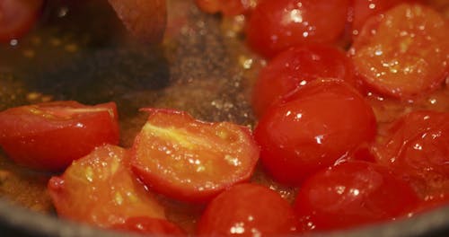 Sauteing Halves Tomatoes On A Hot Pan