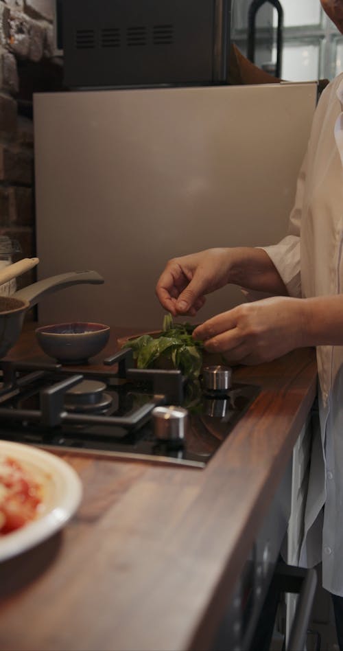 Using Herbs On Top Of A Spaghetti Meal