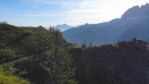 Drone Footage Of A Man Hiking The Mountain 