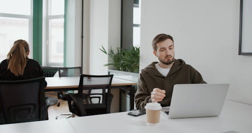 A Man Working In Home Office Set-up