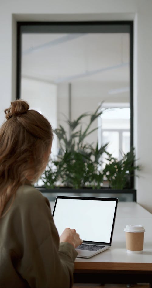 A Woman Using A Laptop