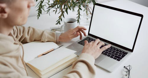 A Man Using Laptop In His Work