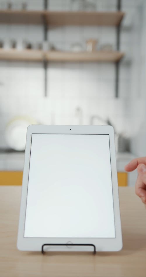 Close-up Footage Of An Ipad Standing In A Holder