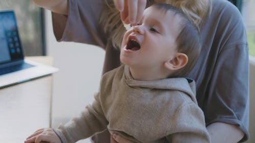 Mother Paying With her Son