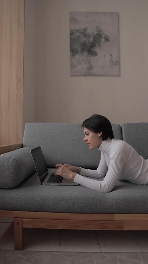 Woman Working On Laptop At Home