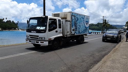  A Slow Moving Delivery Truck On The Seaside Road