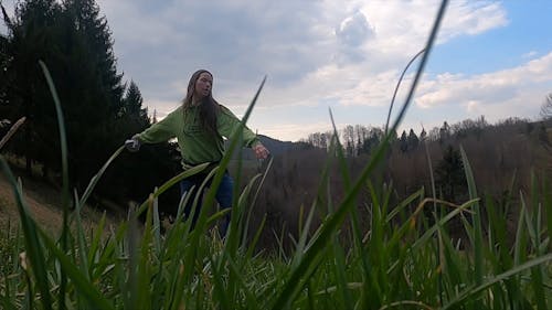 A Woman Dancing Around Enjoying Nature