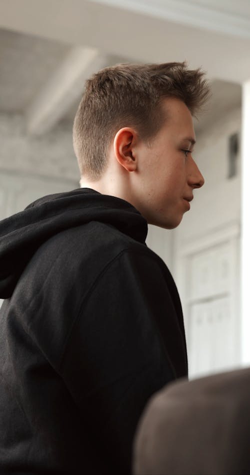 A Young Man In Black Hoodie Undergoing Psychiatric Evaluation