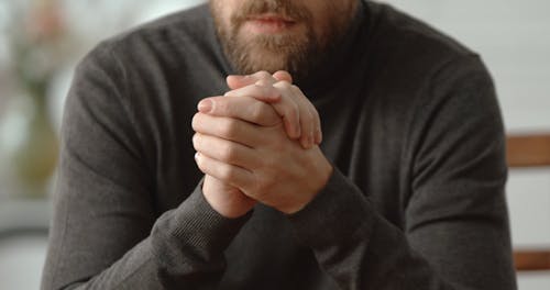 A Male Psychologist Using Hand Signals In Communicating