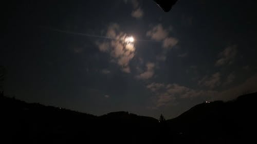 View Of Glowing Moon Above The Mountains