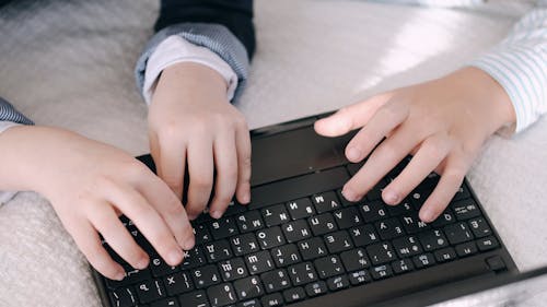 Hans Typing on Laptop Keyboard