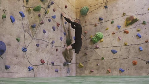 Man With Disability Falling While Doing Wall Climbing