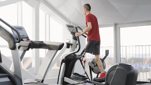 Man With Prosthetic Leg Practicing In A Gym