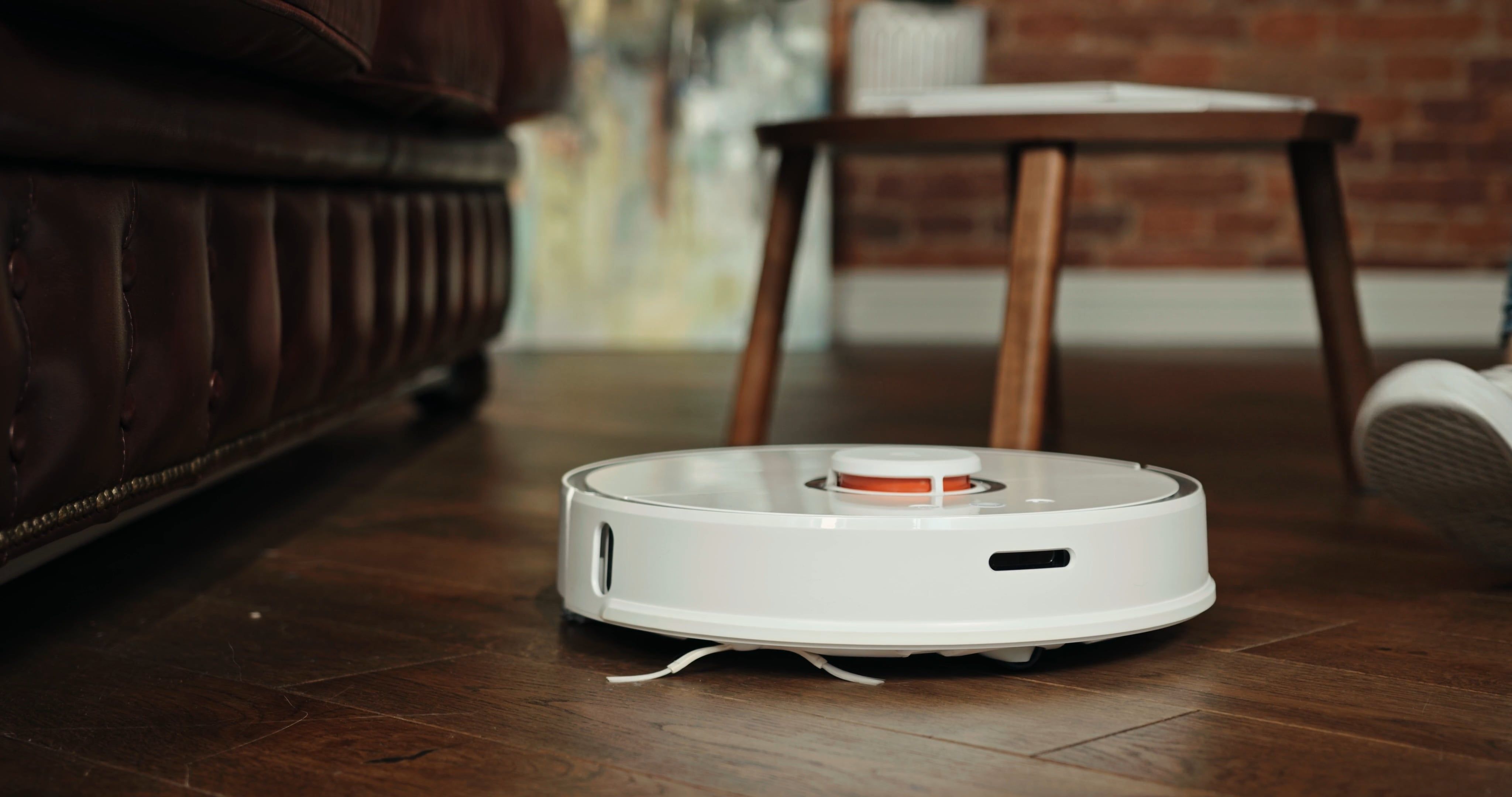 Turning On The Robotic Vacuum Cleaner To Sweep The Floor Free Stock ...
