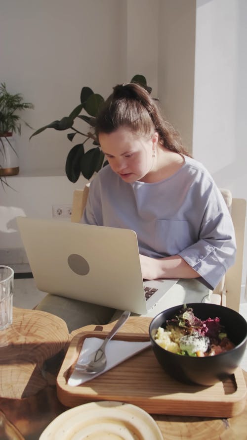 A Woman Using her Laptop