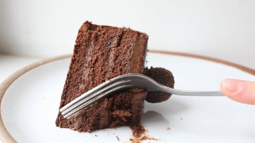 A Person Slicing a Cake