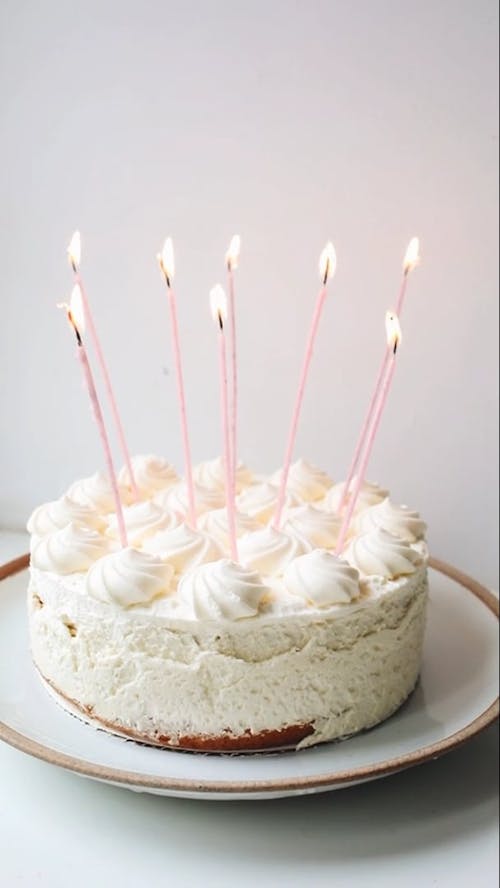 A Homemade Cake With Burning Magic Candles