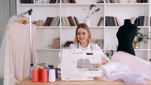 A Woman Sewing using a Sewing Machine