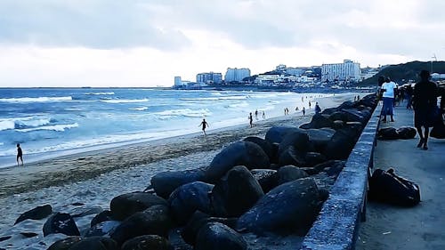 Pan Shot of the People Enjoying the Beach