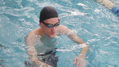 A Man Swimming In The Pool