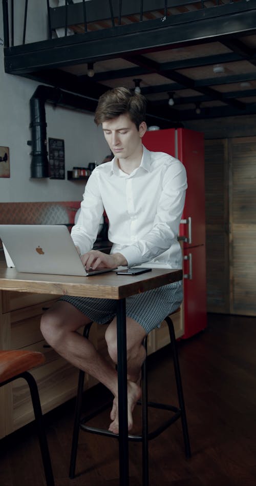 A Man Working On His Laptop While Staying At Home