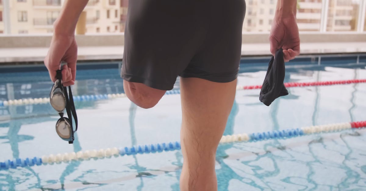 A One Legged Person Standing By The Olympic Pool · Free Stock Video