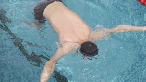 A One Legged Man Swimming In The Pool