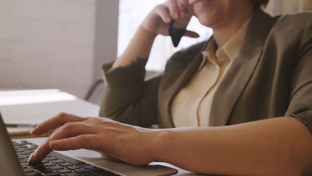 A Woman on a Phone Call Doing Work · Free Stock Video