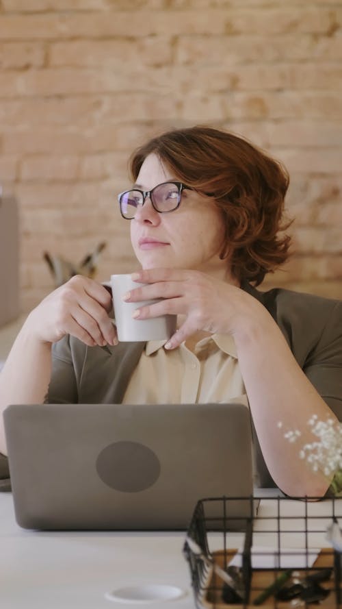 A Woman Taking a Coffee Break