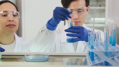 A Man Dropping Samples on the Petri Dish