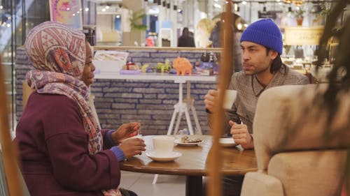 Couple Talking at a Cafe