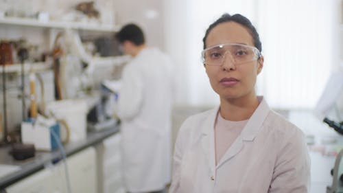 A Woman in the Laboratory Looking at the Camera