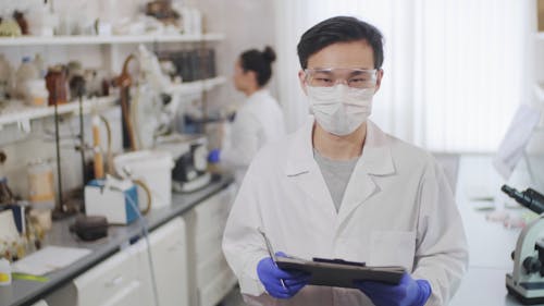A Man Standing in the Laboratory Looking at the Camera