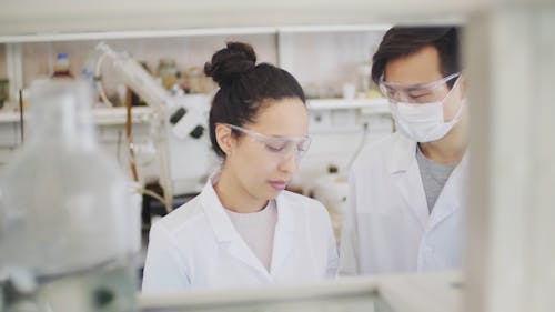 A Man and a Woman having a Discussion in the Laboratory