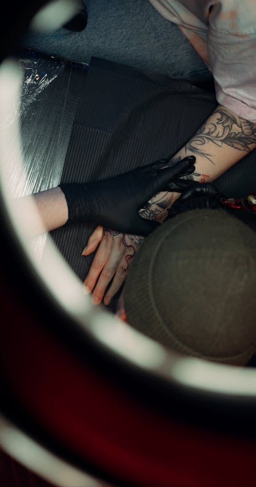 Tattooing A Person Hand