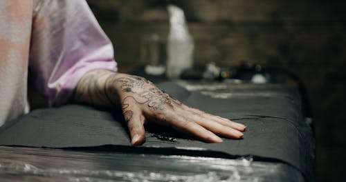 A Customer Hand Getting A Tattoo