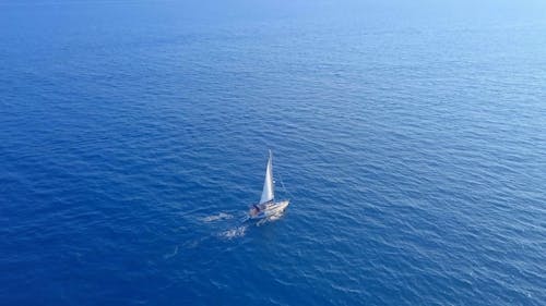 A Sailboat Crossing The Ocean